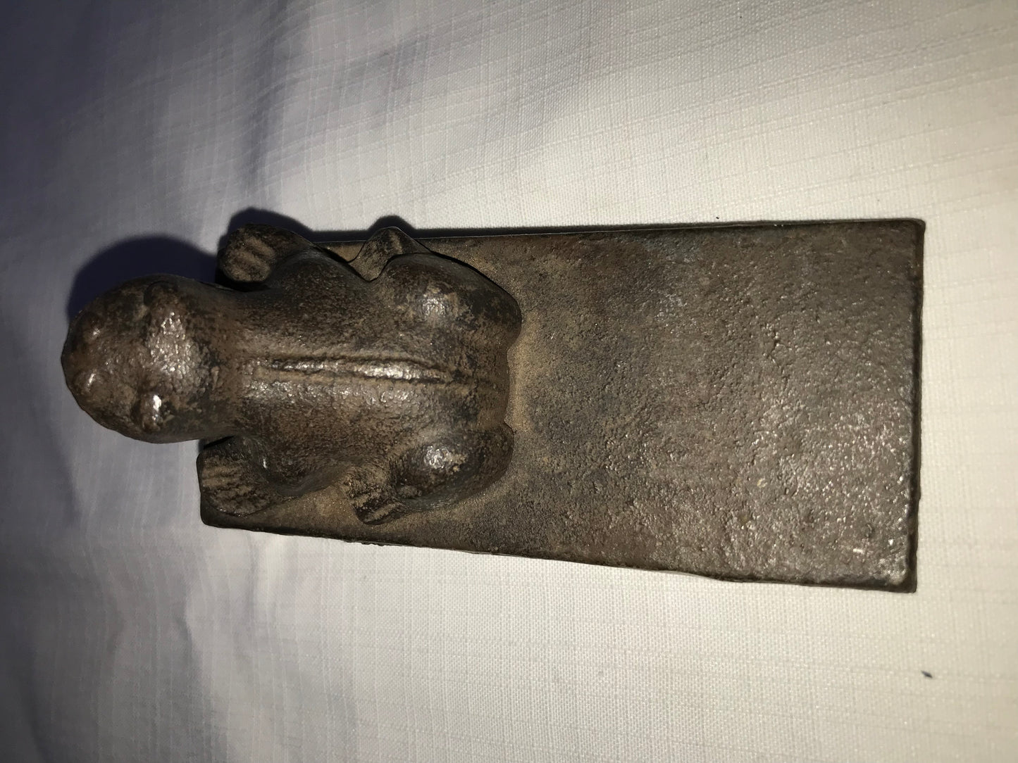 Heavy metal frog door stop