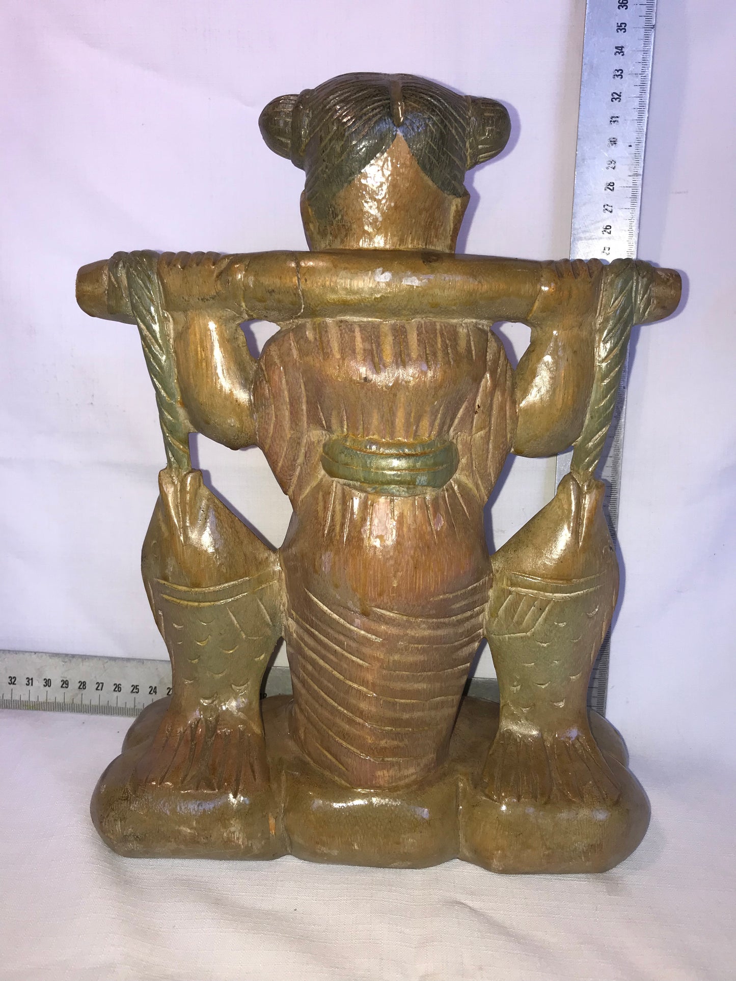 Eastern carved wooden statue