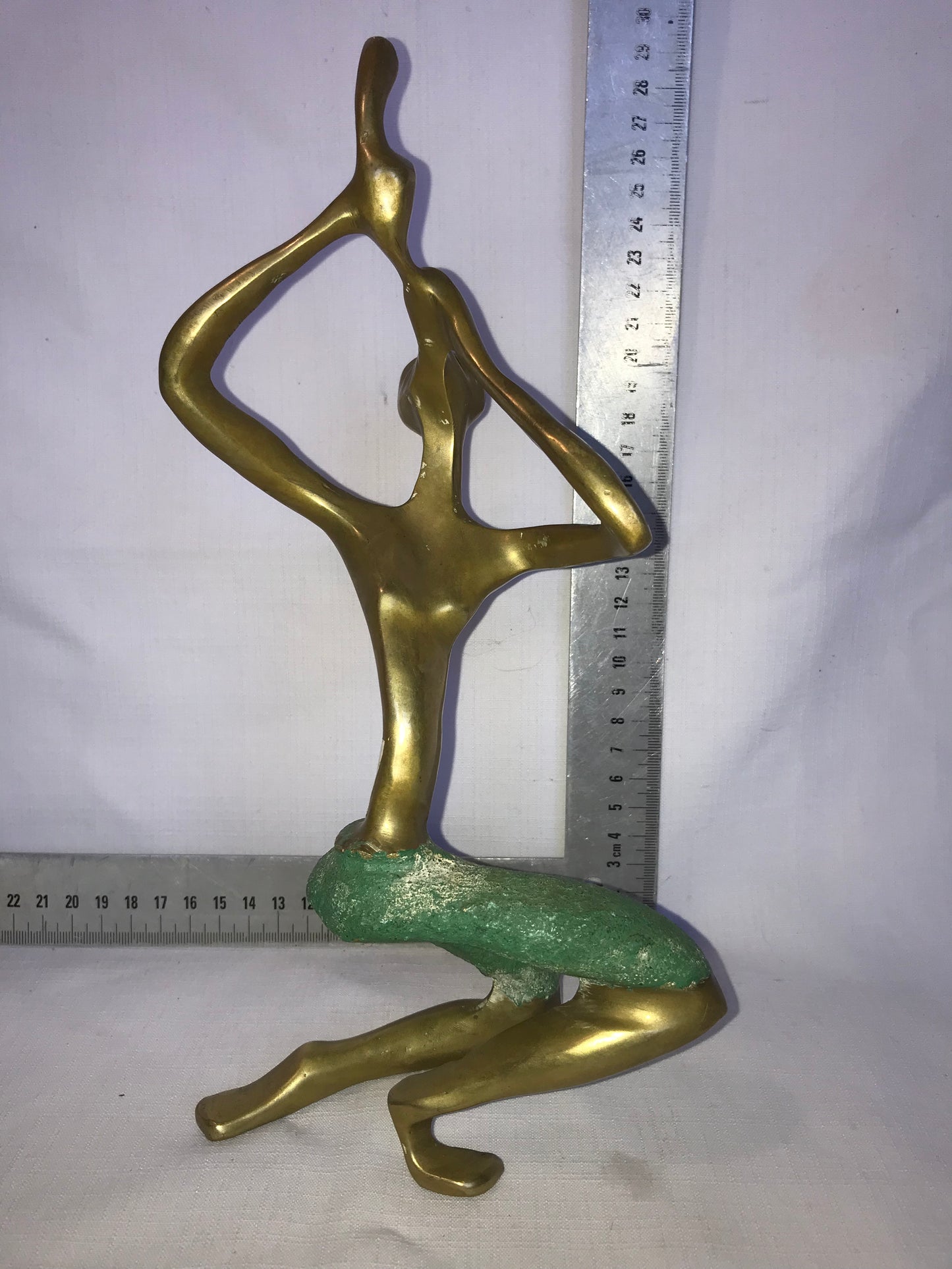 Brass flute player statue