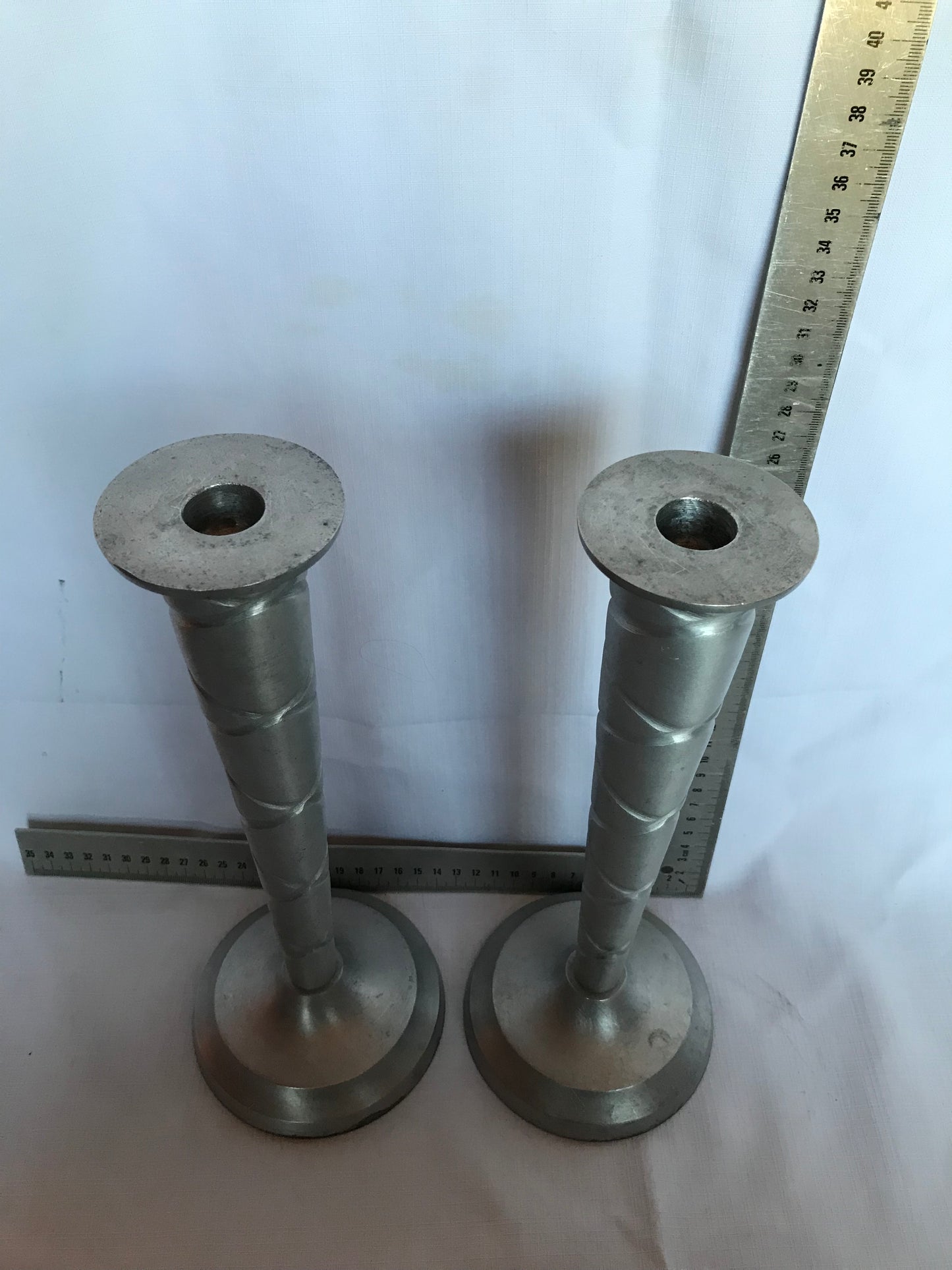 Pair of tall candle sticks