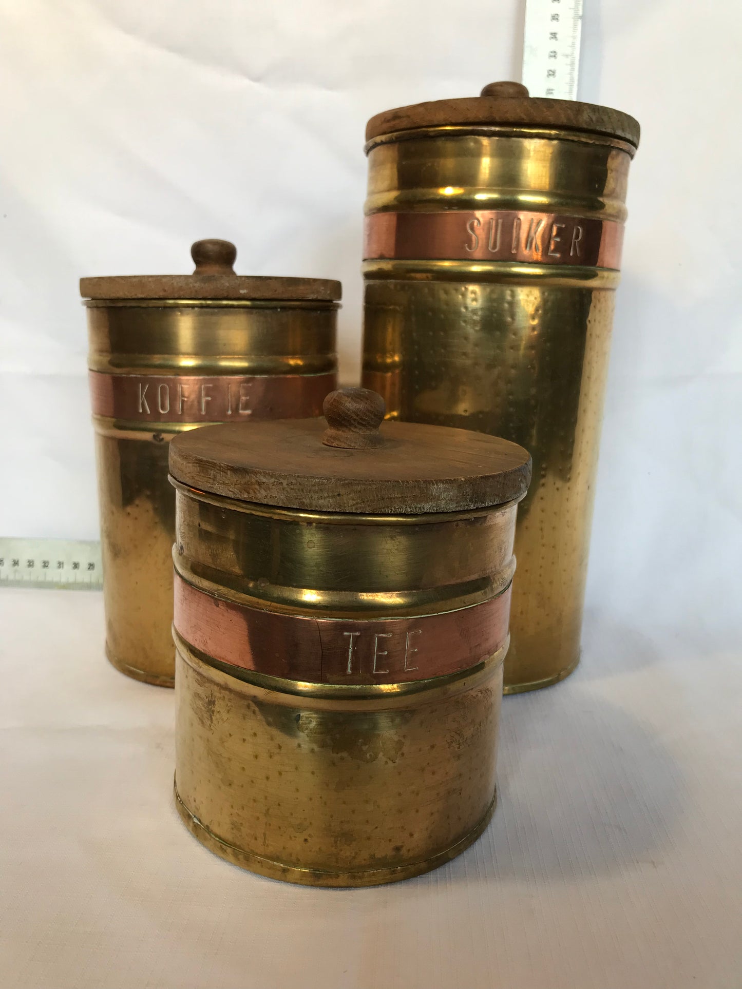 Set of three brass and copper containers