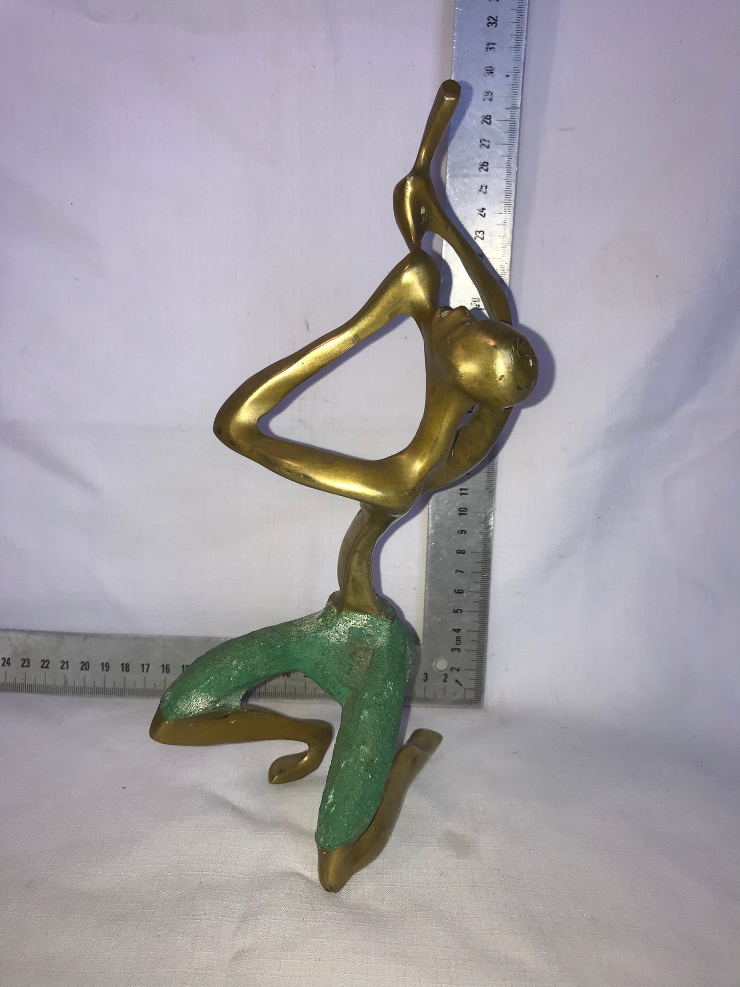 Brass flute player statue