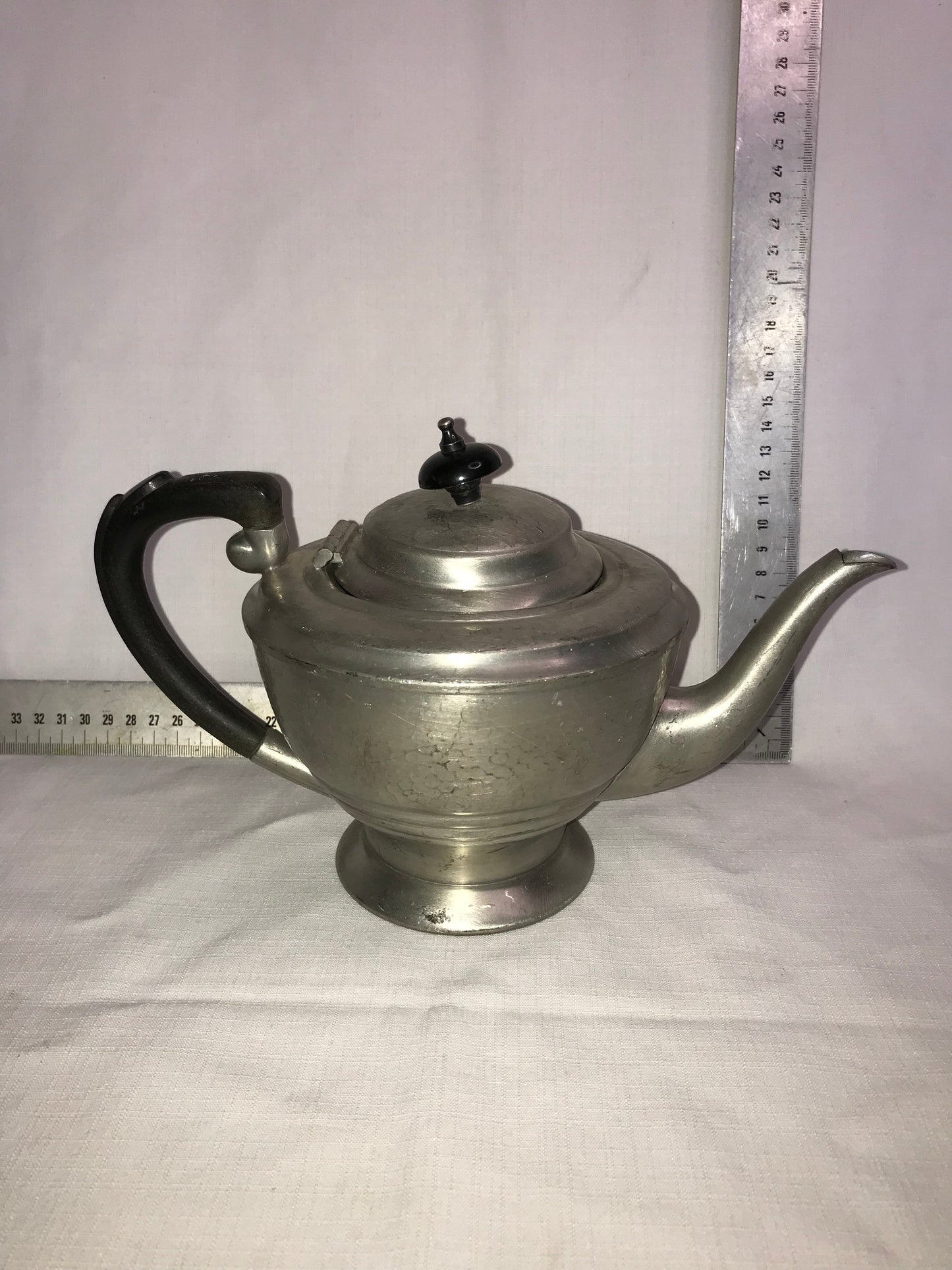 Pewter tea pot with dents for character