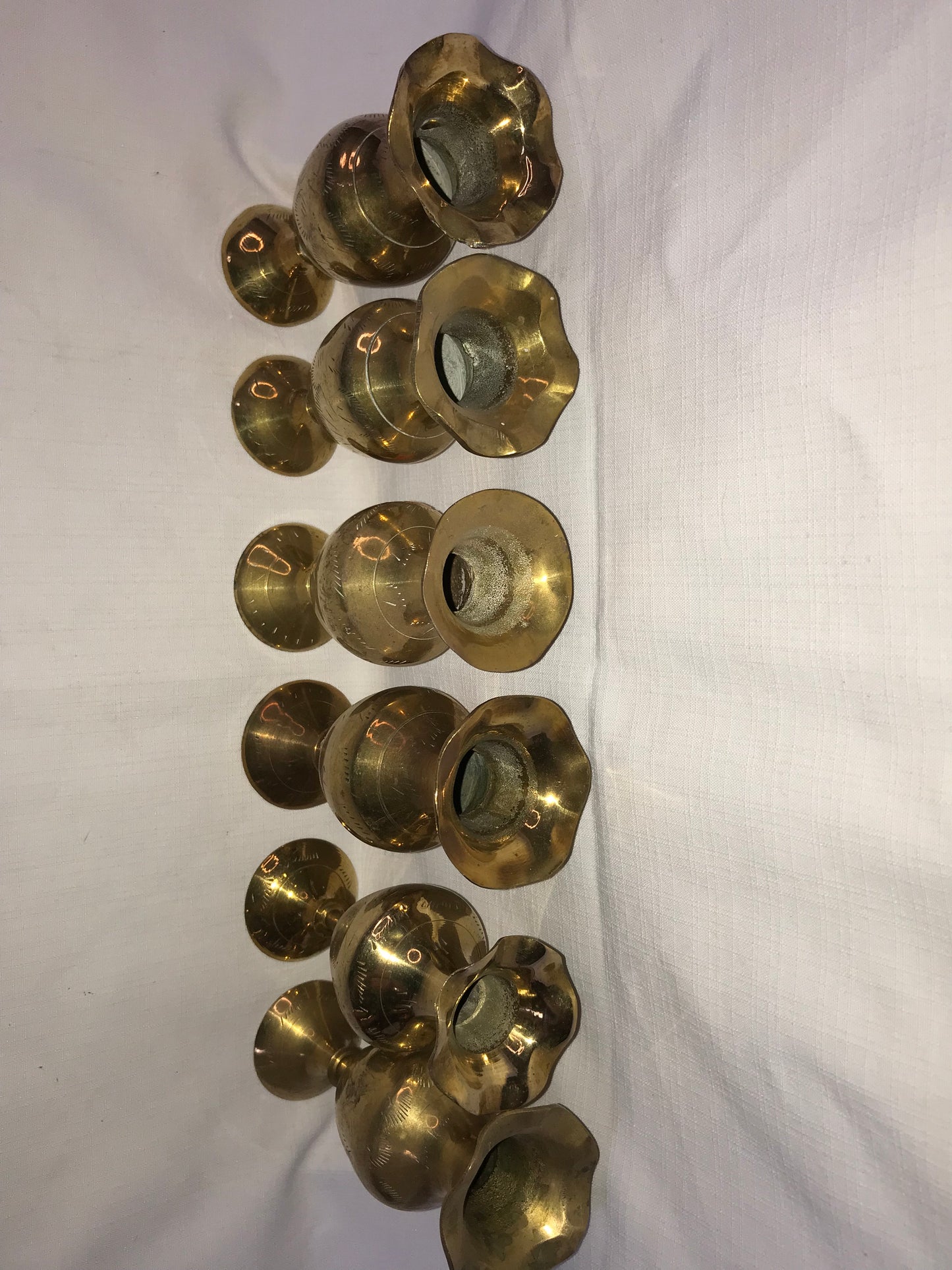 6 small brass vases
