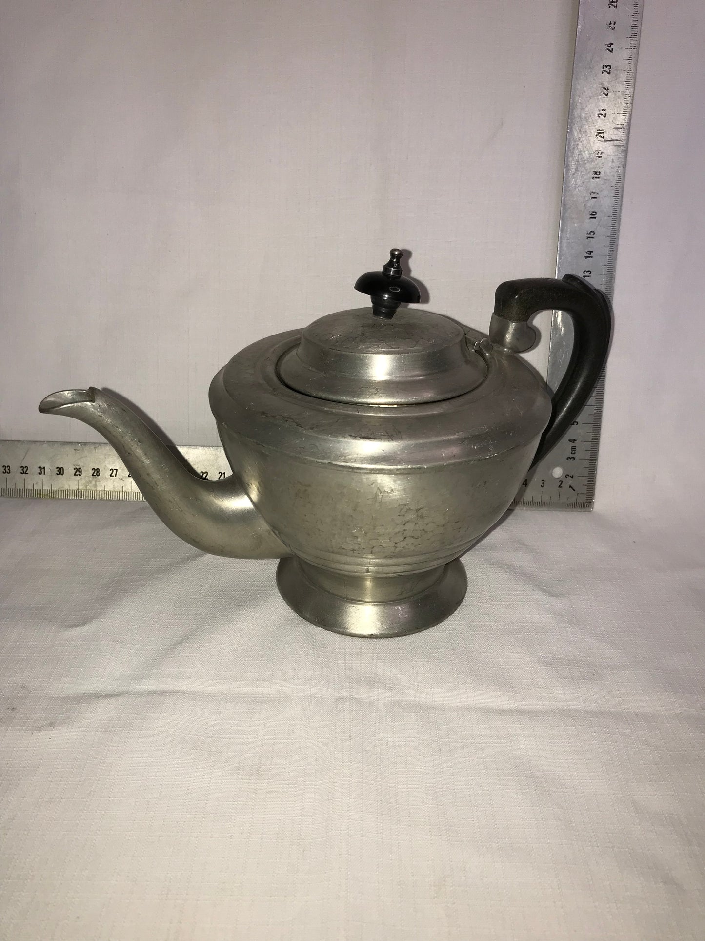 Pewter tea pot with dents for character
