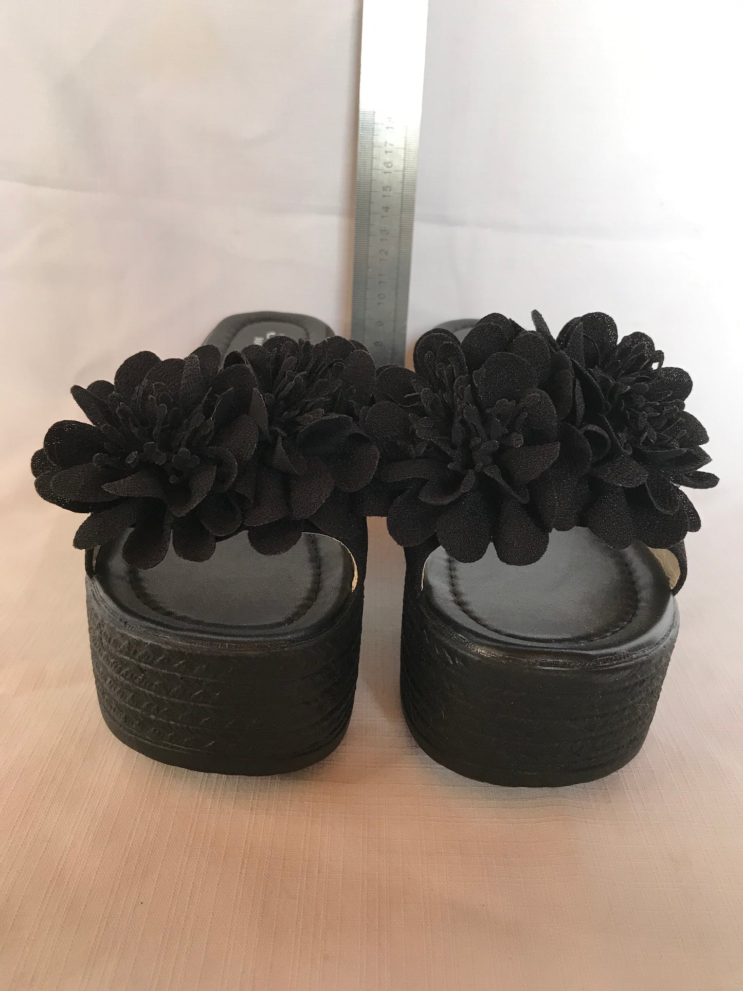 Black wedge platform with flower detail size 7