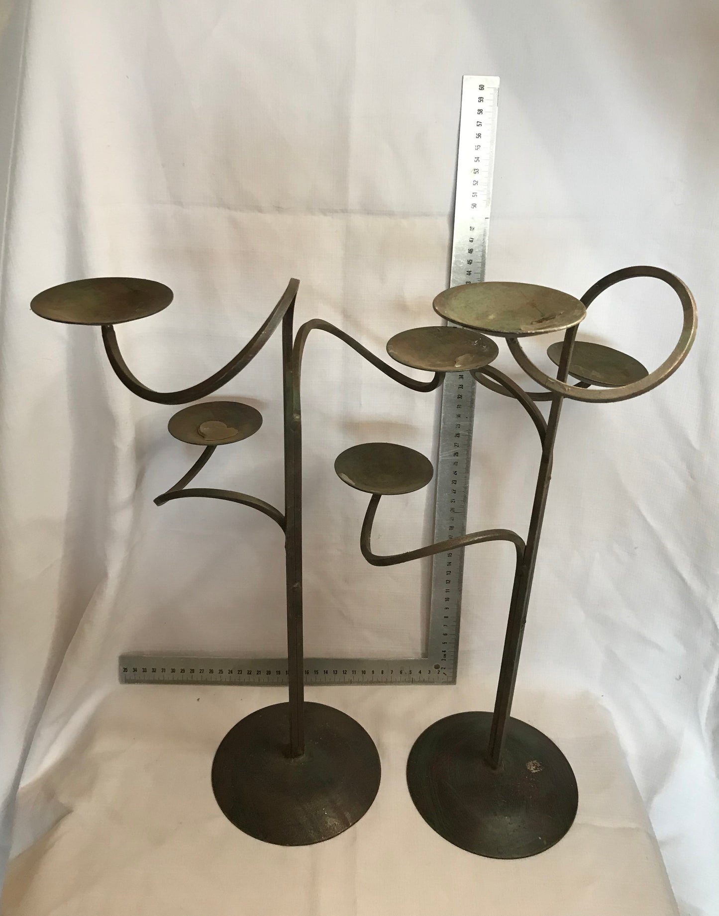 Pair tall metal candle sticks with 3 candle holders on each