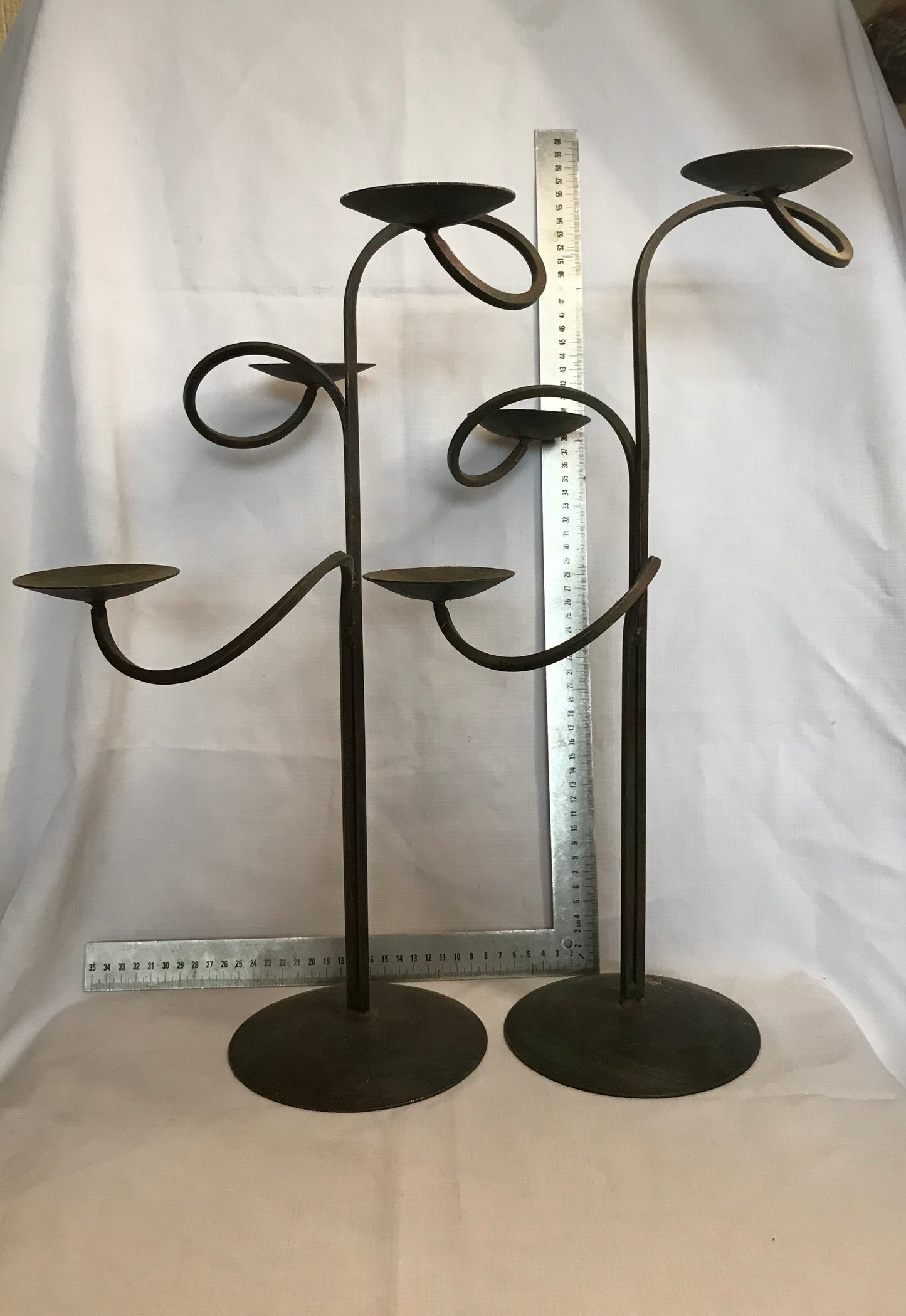 Pair tall metal candle sticks with 3 candle holders on each