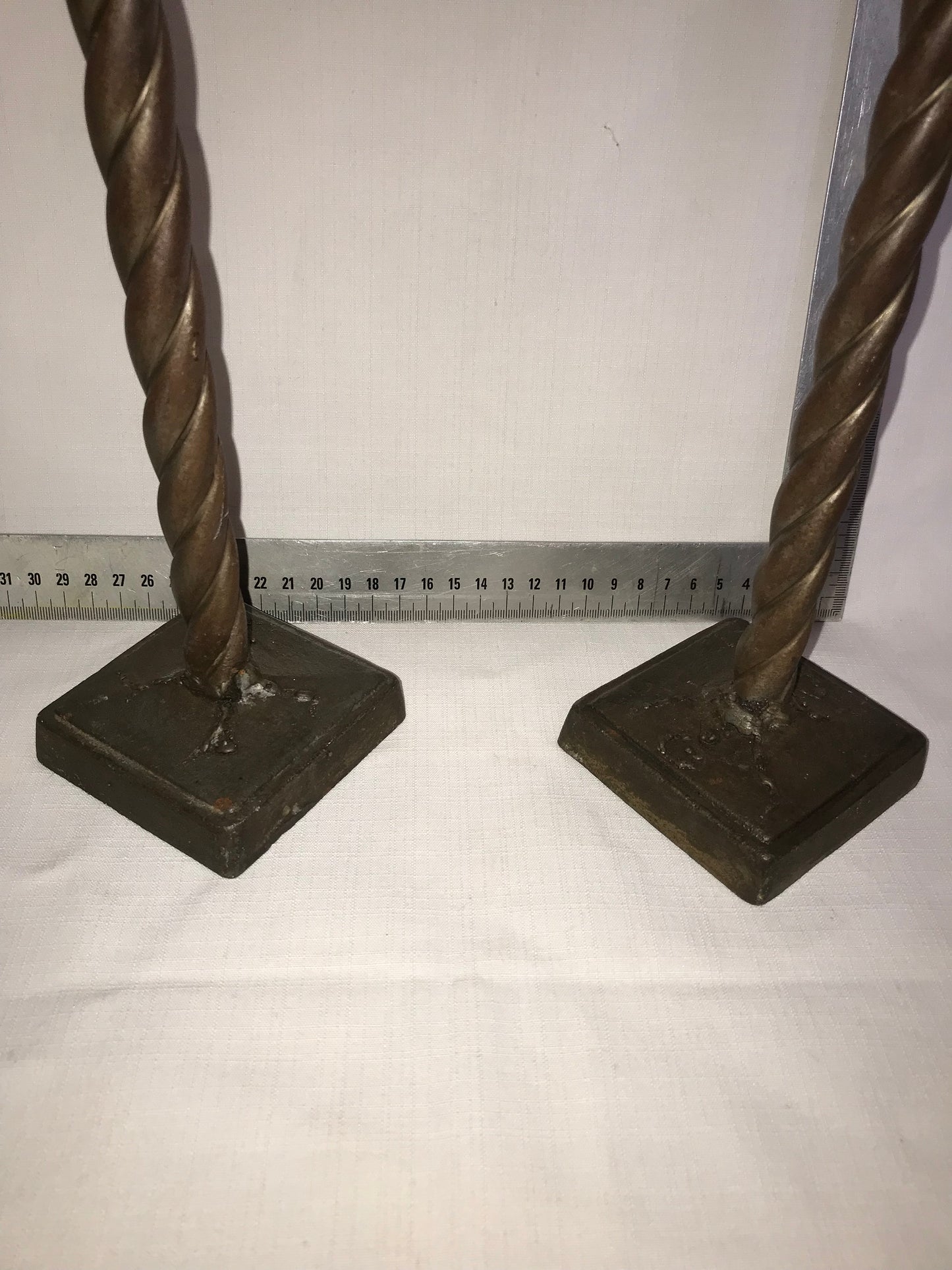 Pair of twisted metal candle sticks