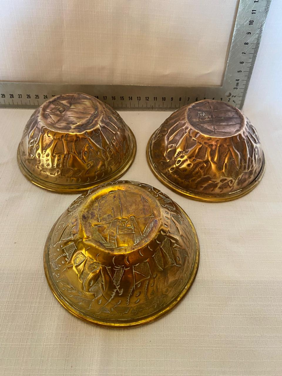 Group of 3 small brass bowls