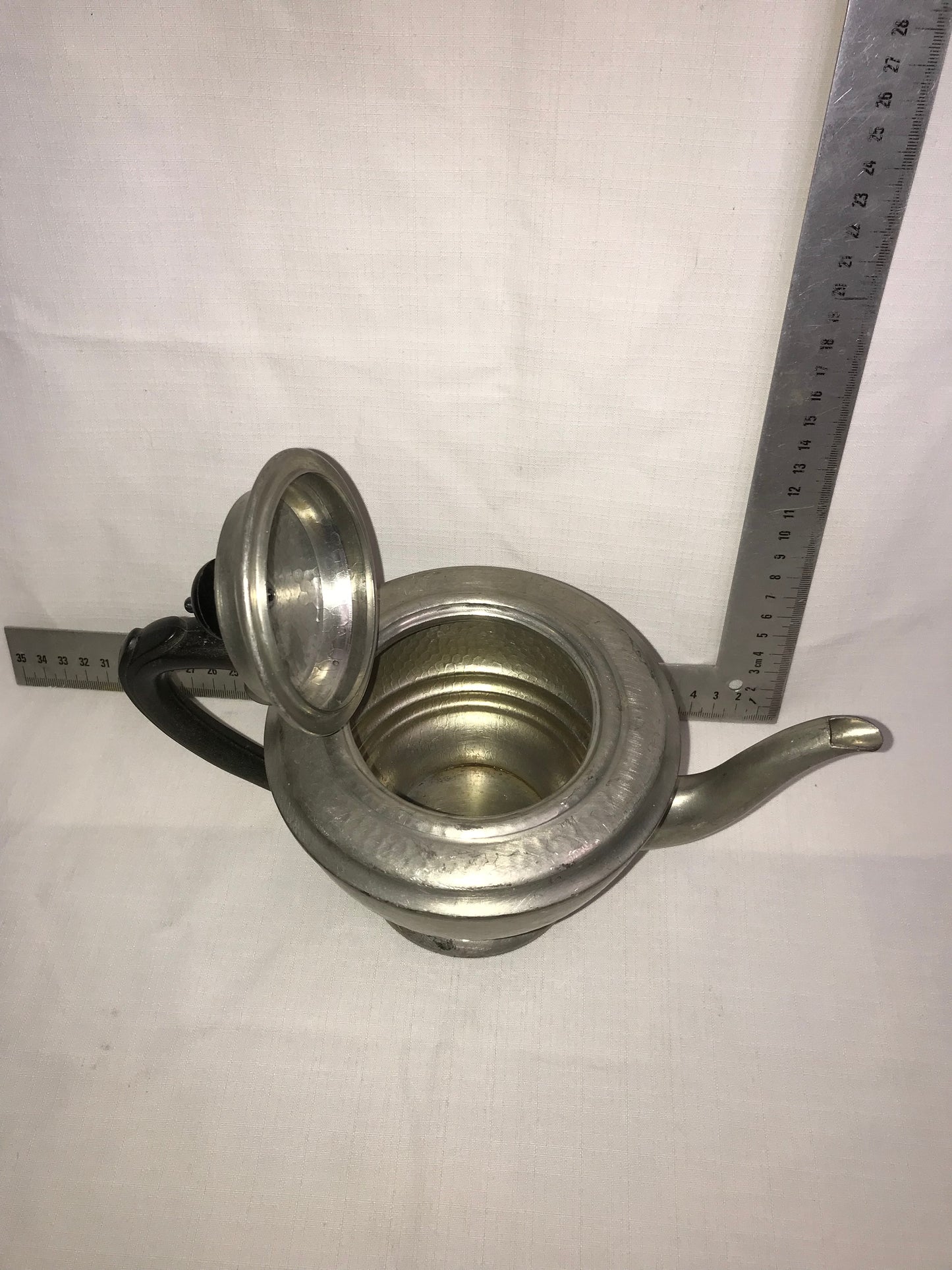 Pewter tea pot with dents for character