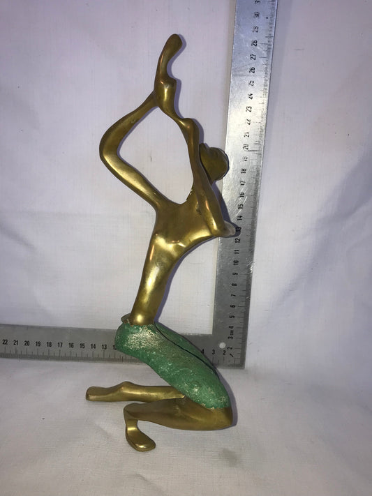 Brass flute player statue