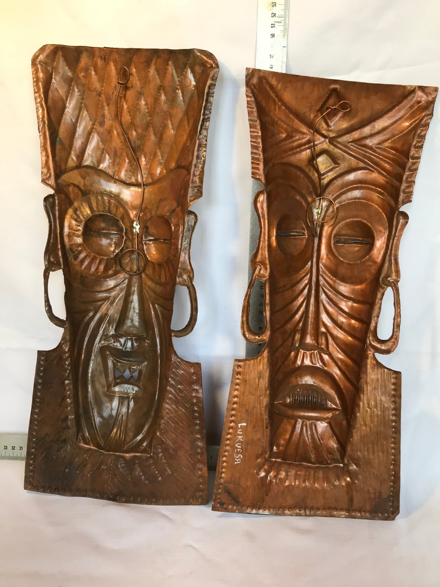 Copper pair of African masks