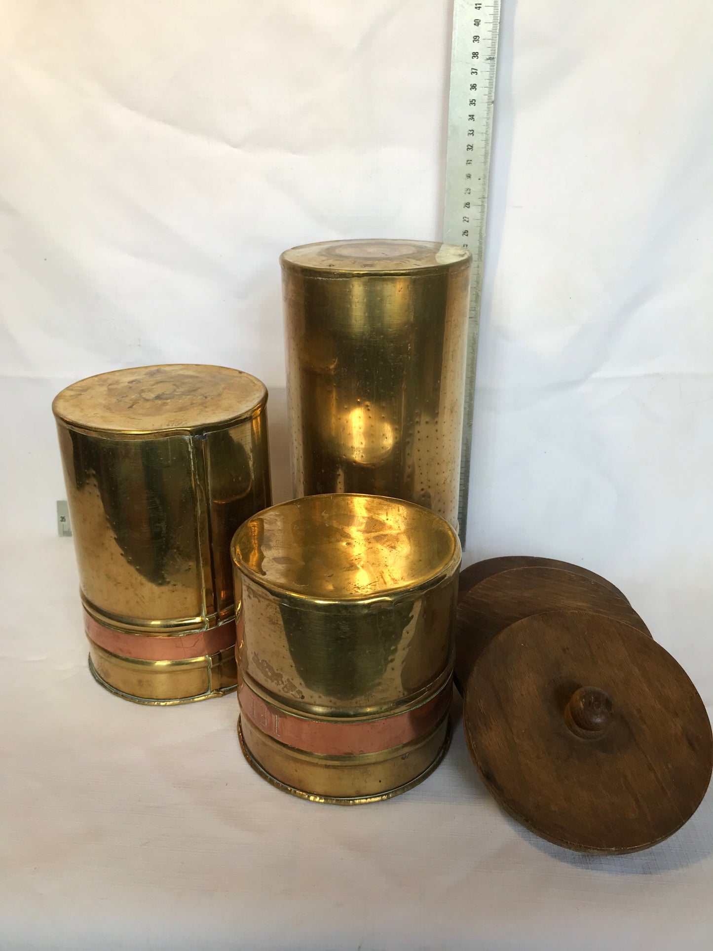Set of three brass and copper containers