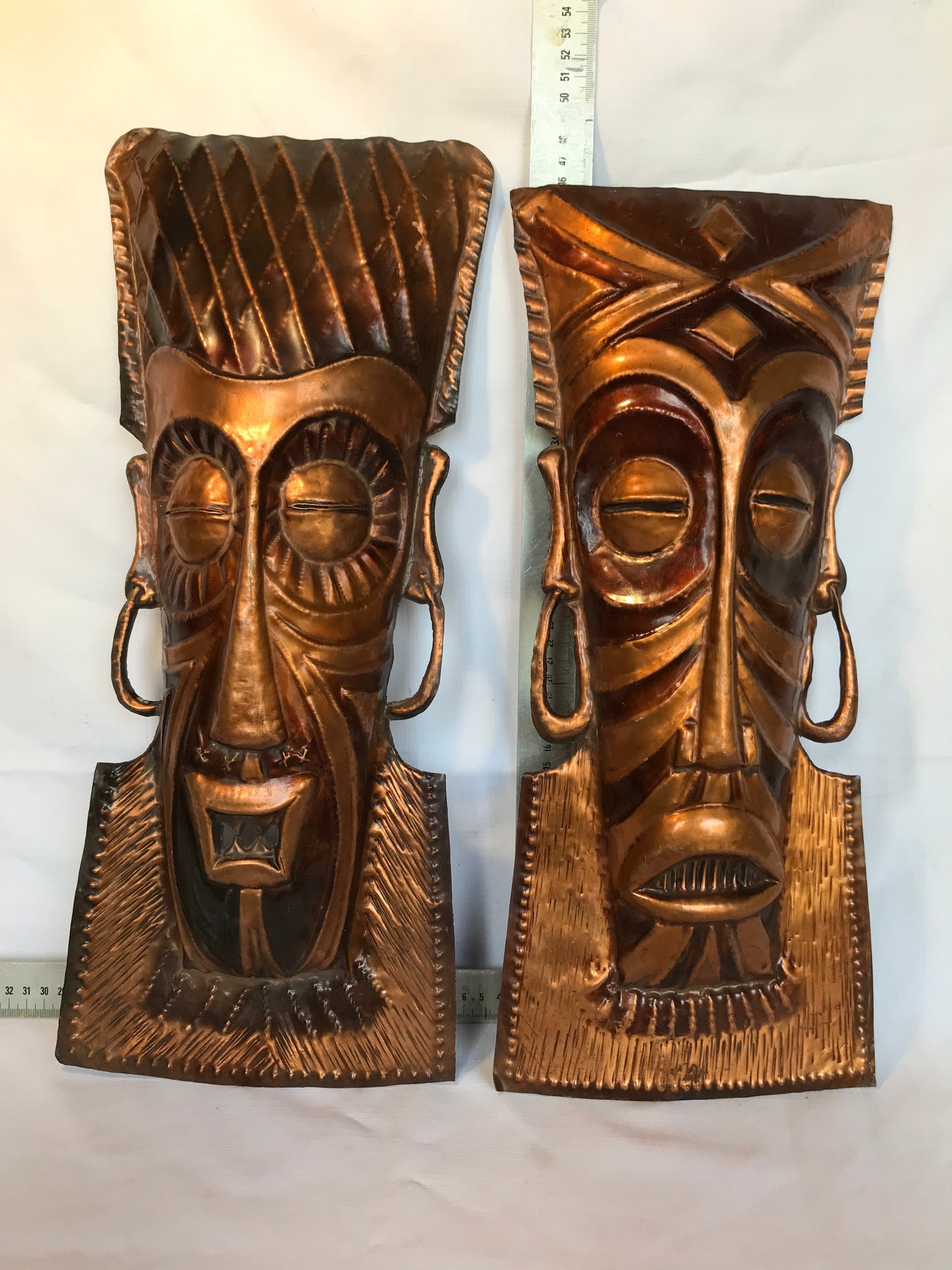 Copper pair of African masks
