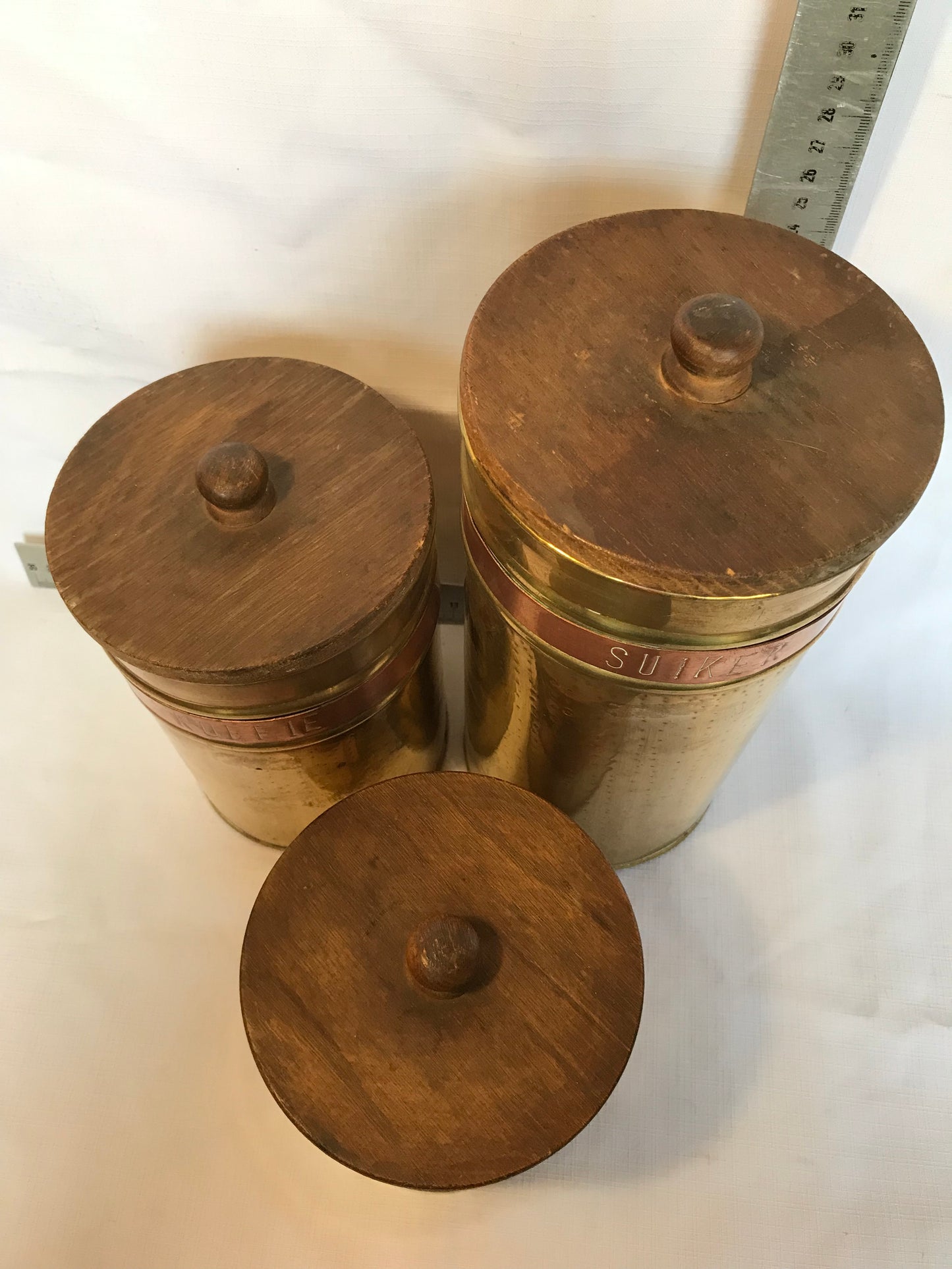 Set of three brass and copper containers