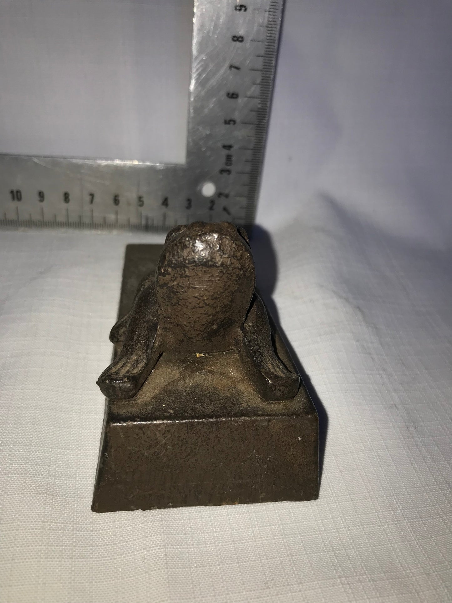 Heavy metal frog door stop