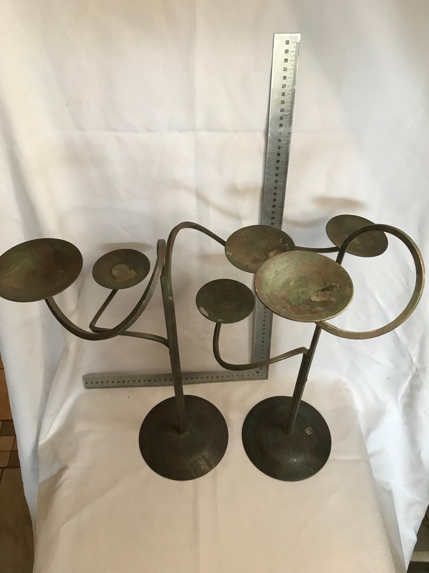 Pair tall metal candle sticks with 3 candle holders on each