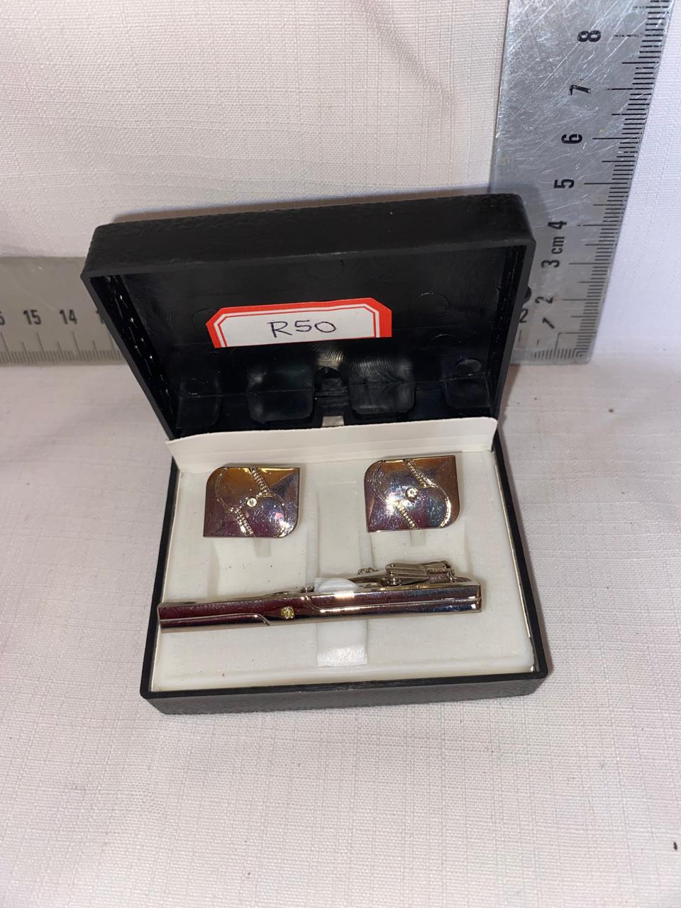 Cuff links and tie pin in box