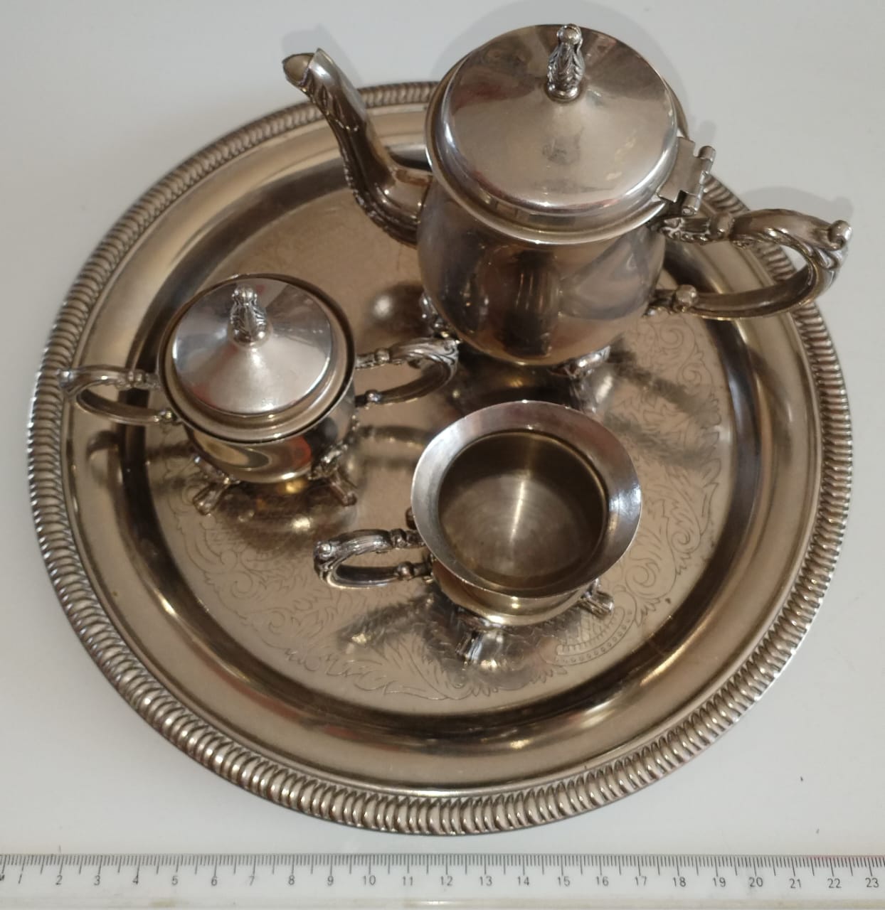 Mini EPNS tea set for one. Tea pot is 12cm high.