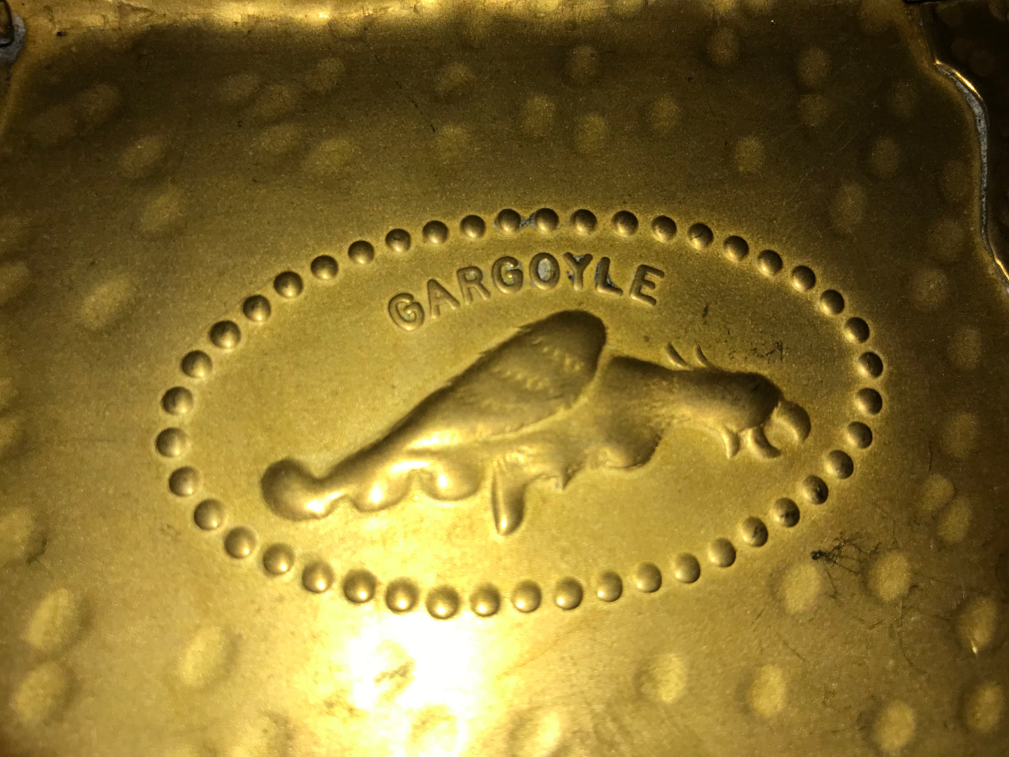 Brass box that says Gargoyle on top