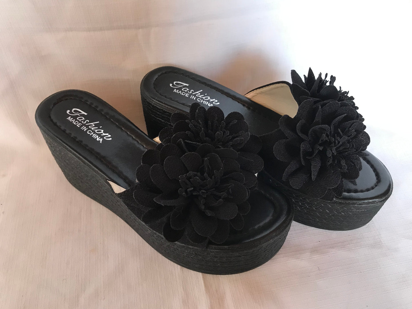 Black wedge platform with flower detail size 7