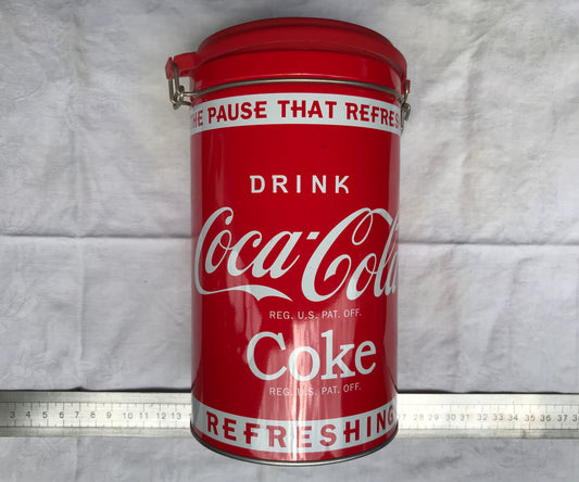 Pre-loved tall round Coca-Cola tin