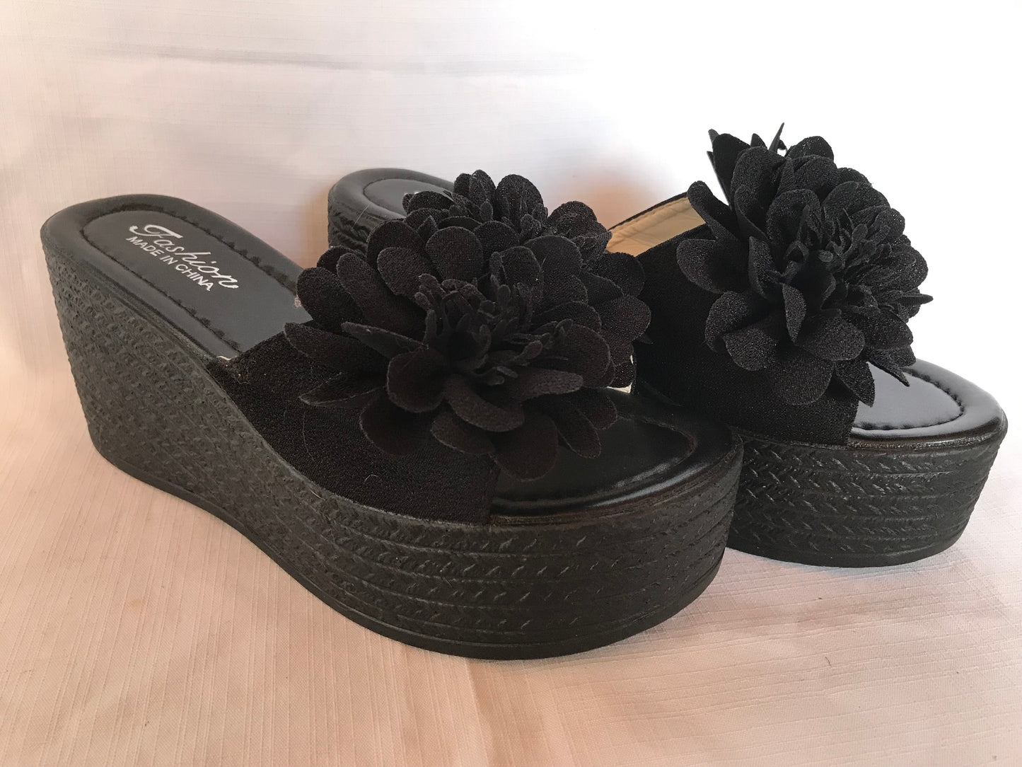 Black wedge platform with flower detail size 7