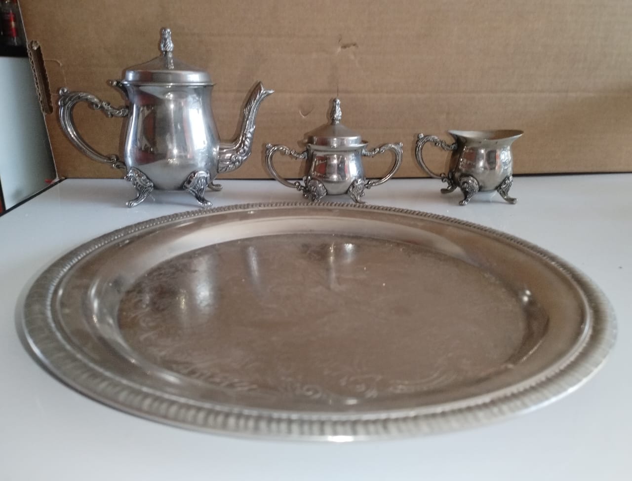 Mini EPNS tea set for one. Tea pot is 12cm high.