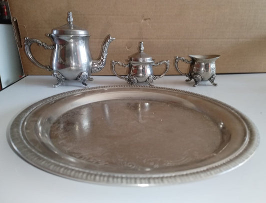 Mini EPNS tea set for one. Tea pot is 12cm high.