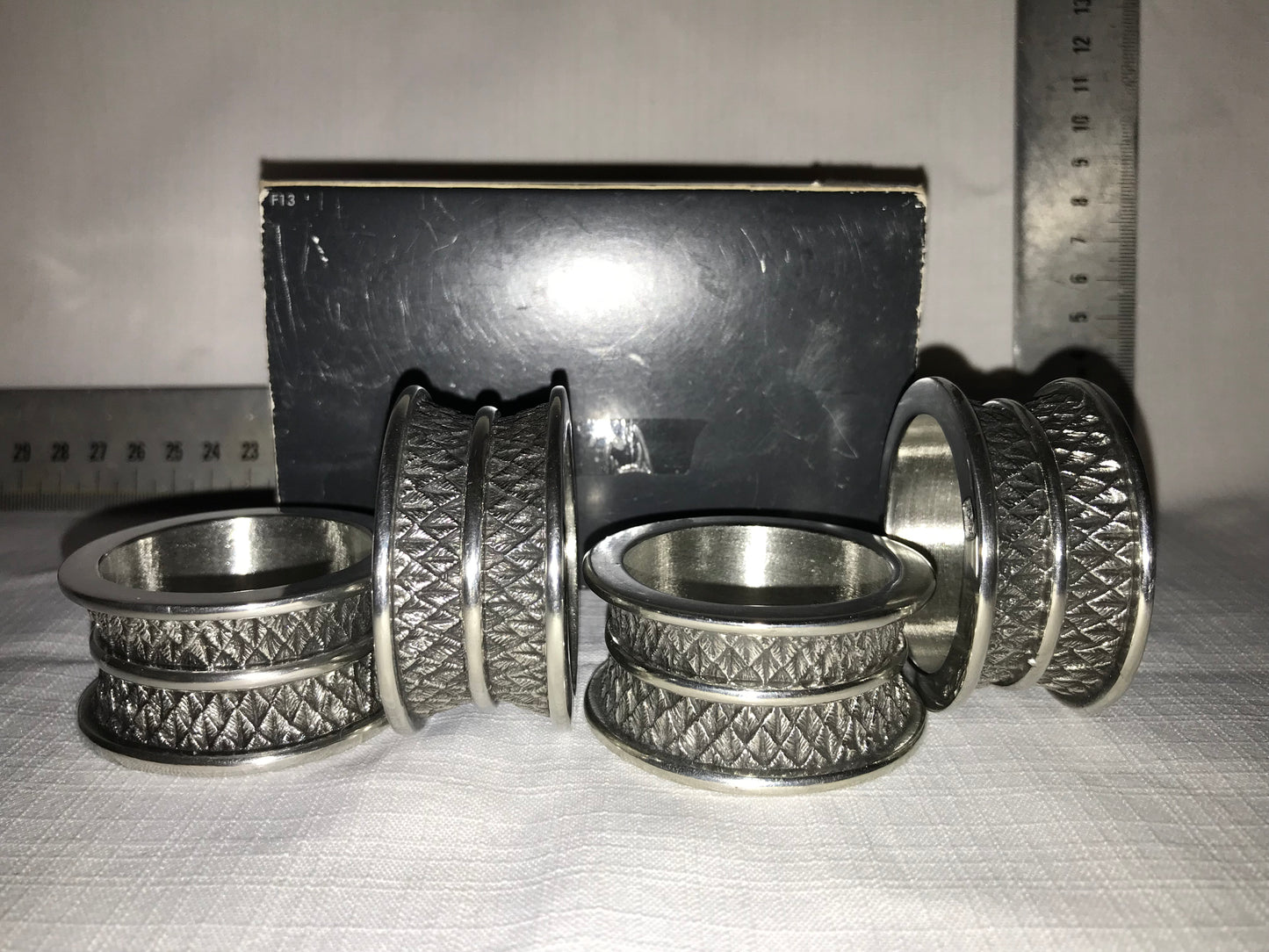 Diana Carmichael 4 metal napkin rings in box