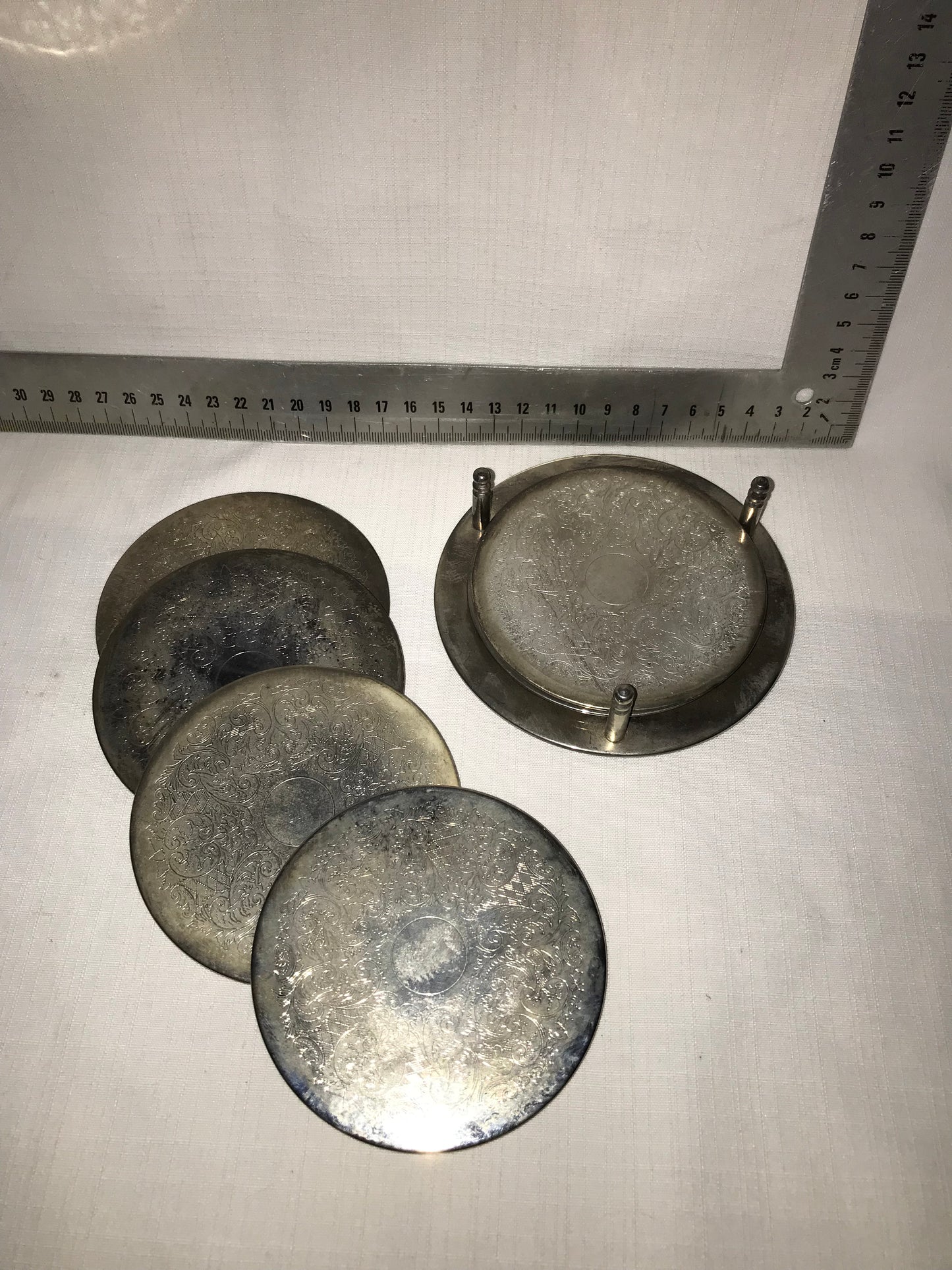 6 Metal coasters on stand
