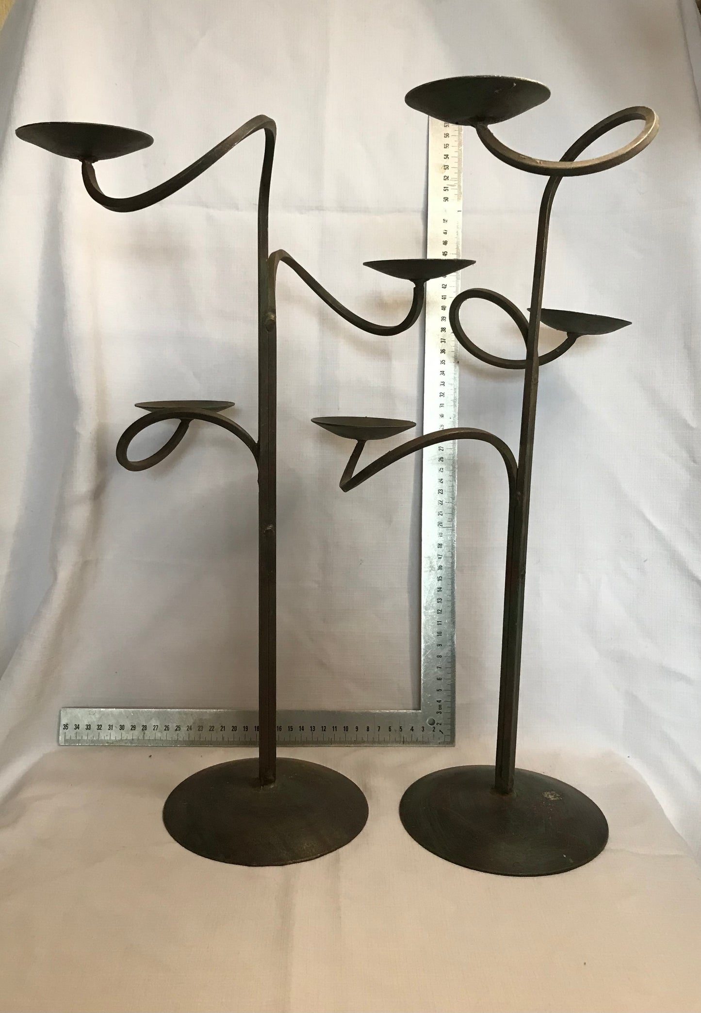 Pair tall metal candle sticks with 3 candle holders on each