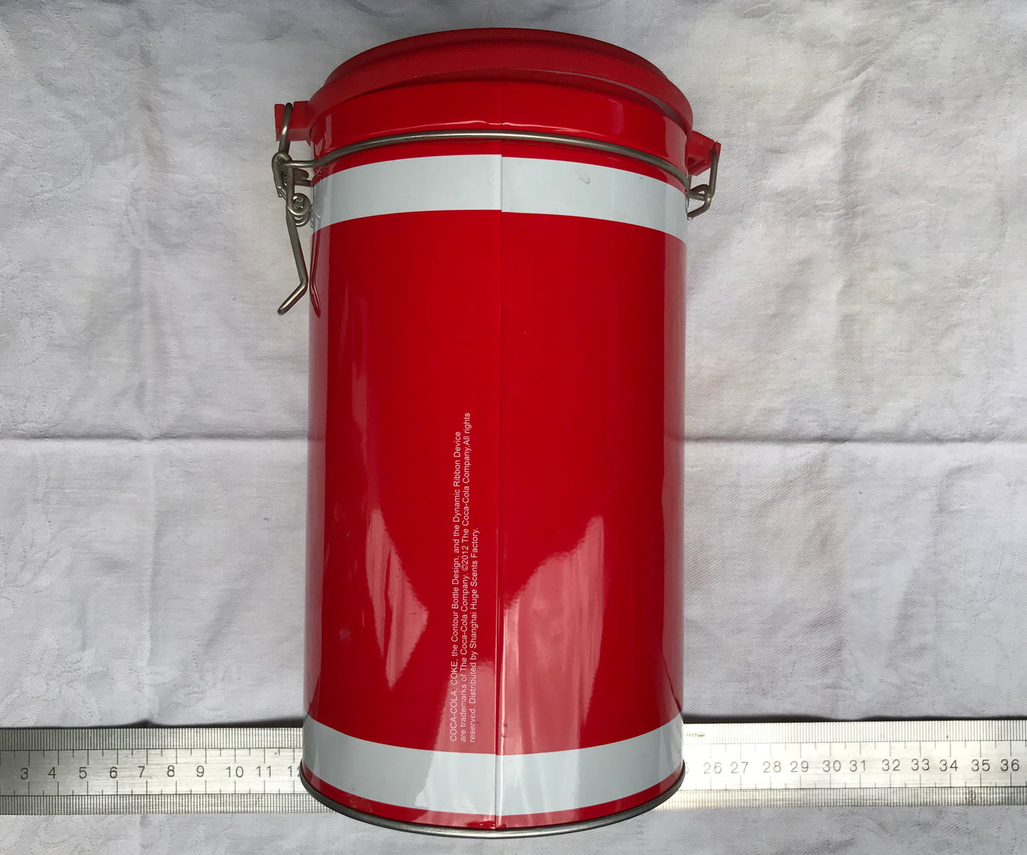 Pre-loved tall round Coca-Cola tin