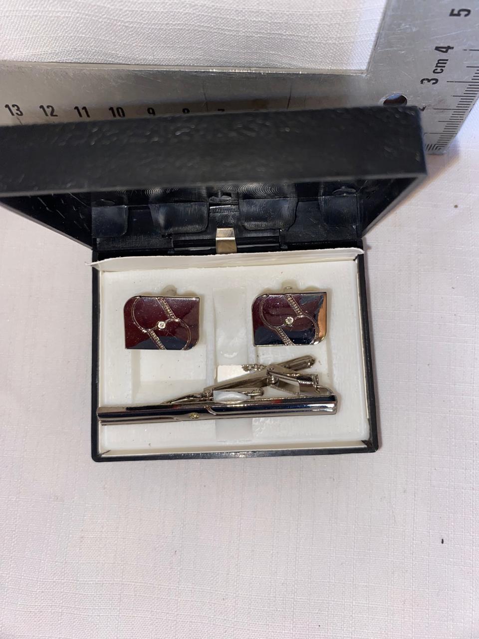 Cuff links and tie pin in box