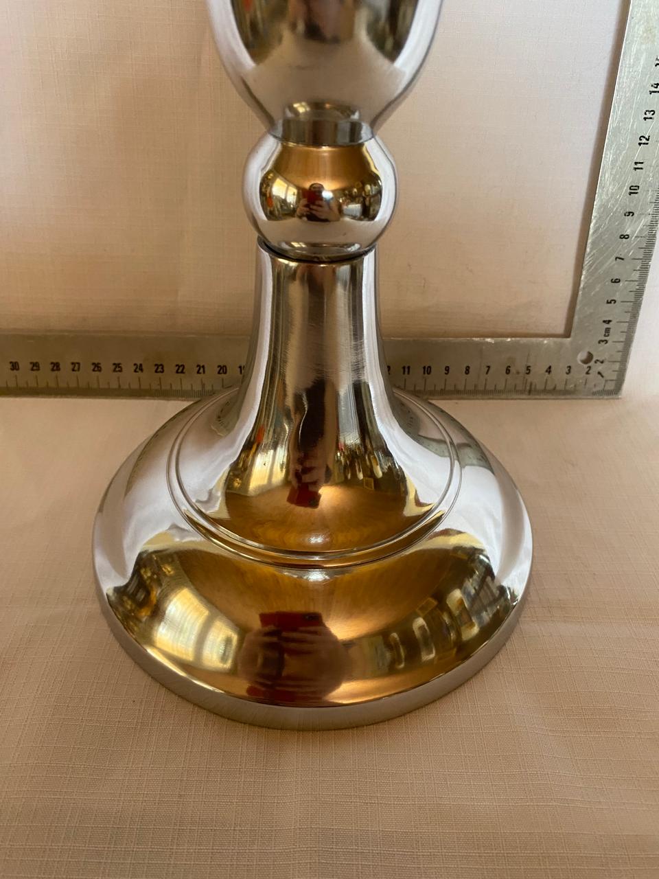 Tall metal candle stick