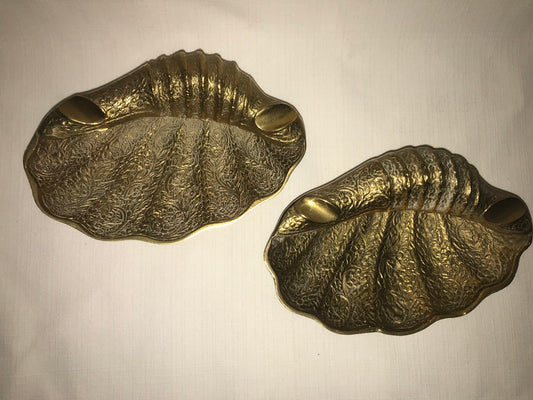 Two brass sea shell ass tray's