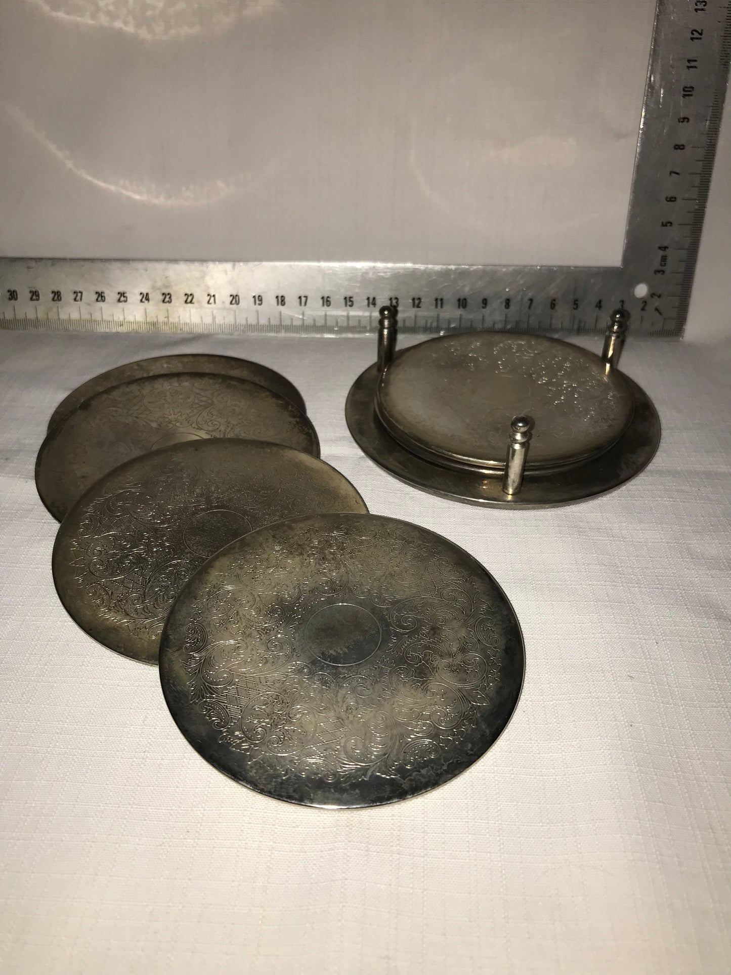 6 Metal coasters on stand