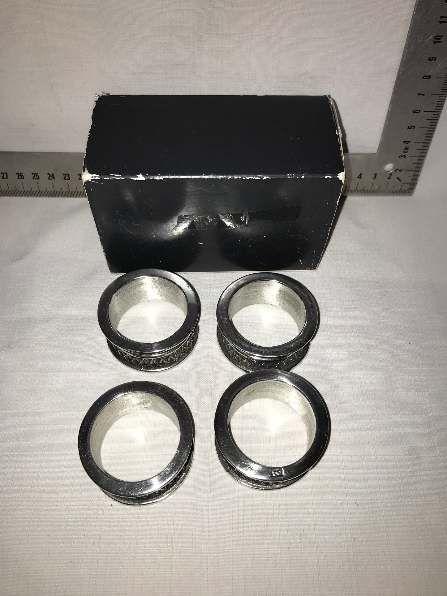 Diana Carmichael 4 metal napkin rings in box
