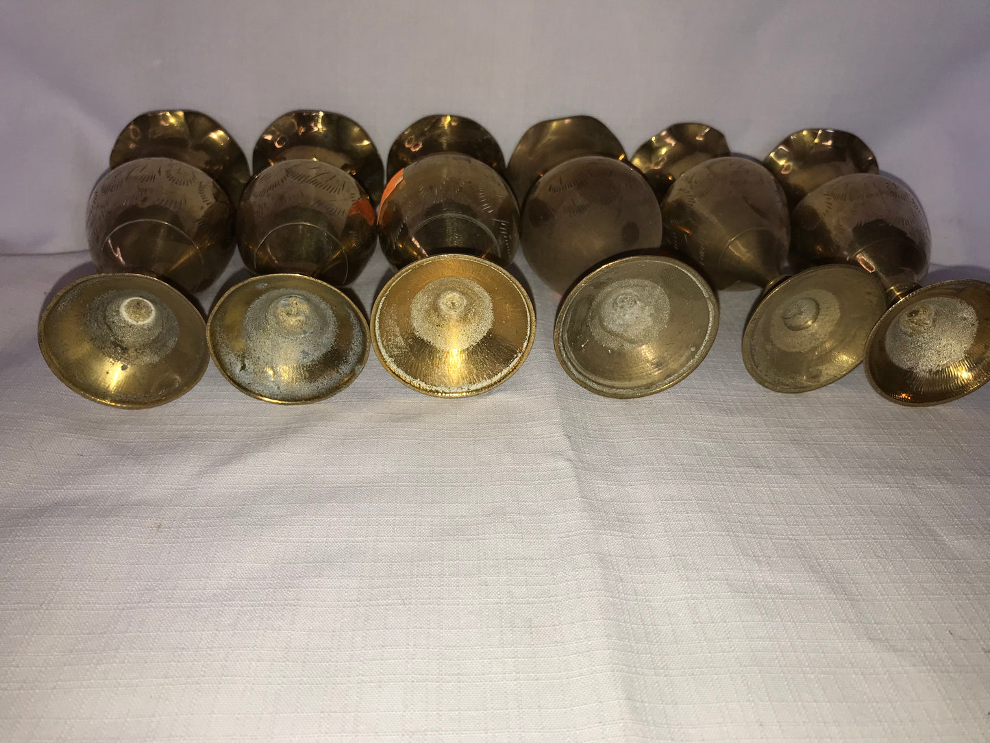 6 small brass vases