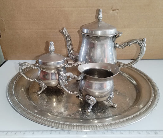 Mini EPNS tea set for one. Tea pot is 12cm high.