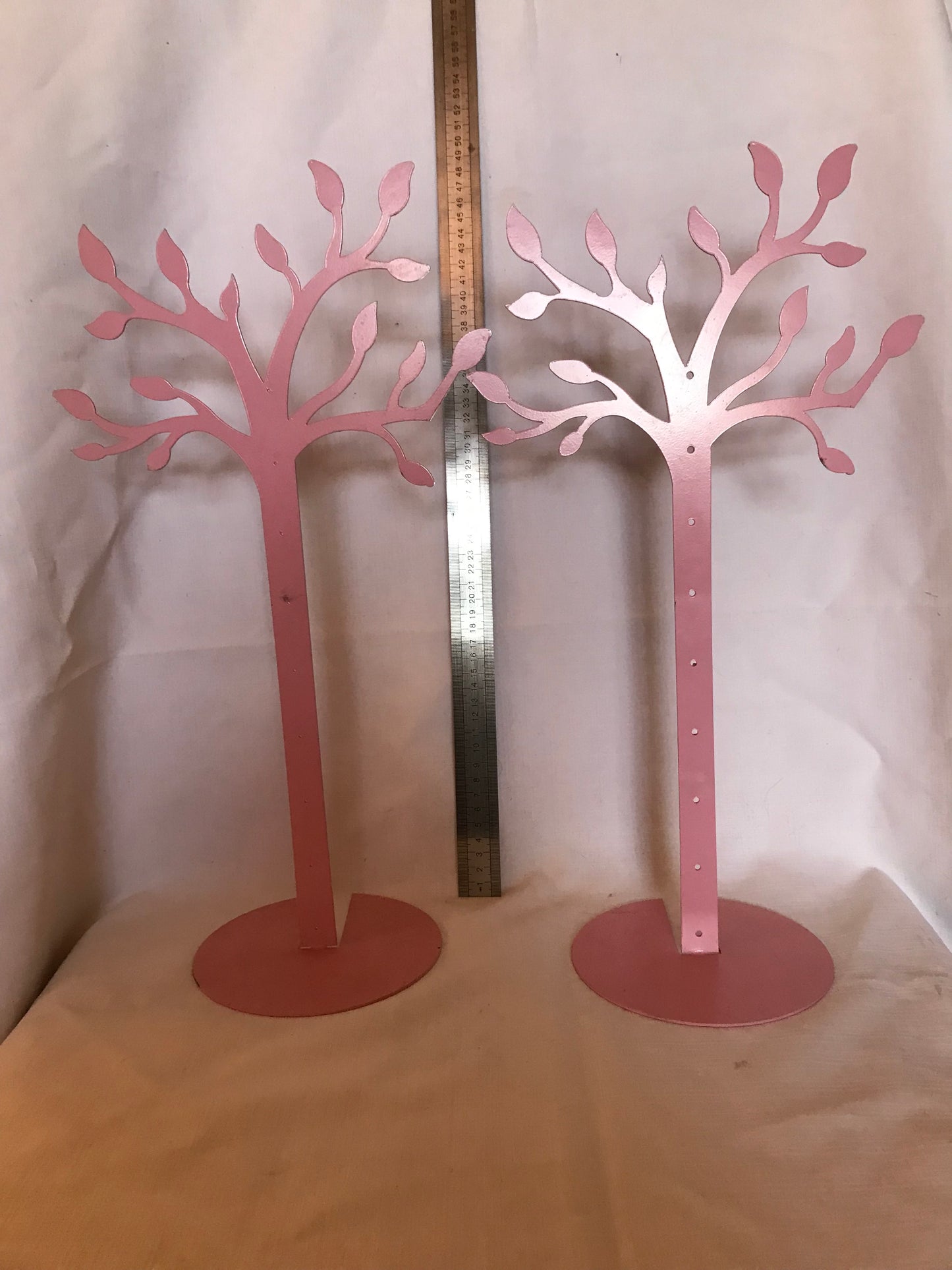 Pair of pink jewelry and accessories stands, pre-loved