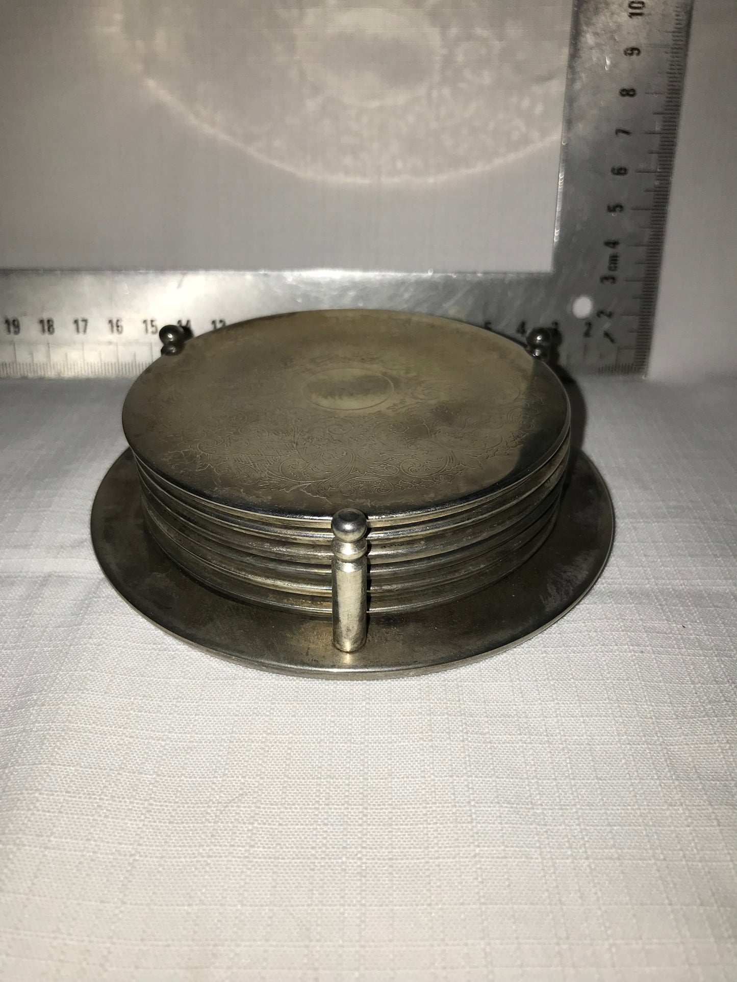 6 Metal coasters on stand